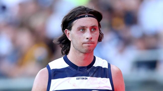 A pensive Jack Henry leaves the field with an injury after facing Hawthorn. Kelly Defina/Getty Images)