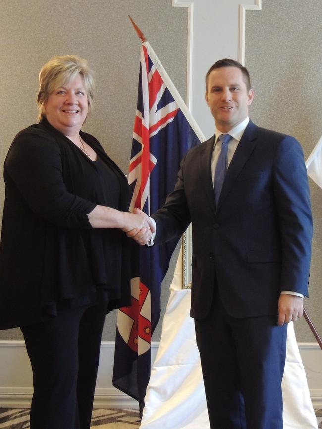 Retired constable Julie Anne Lawson receives her National Police Service Medal from Mitchell federal MP Alex Hawke.