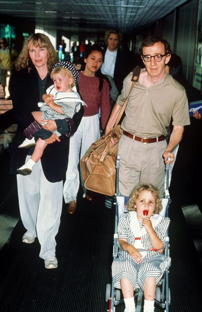 Mia Farrow and Woody Allen, with Farrow’s adopted daughter Soon-Yi Previn walking behind. Picture: Charge