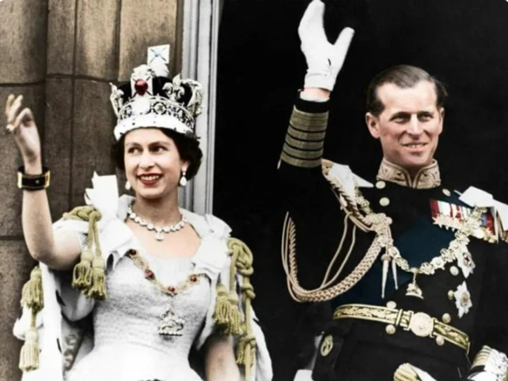 Queen Elizabeth II and the Duke of Edinburgh on the day of their coronation, Buckingham Palace, 1953. (Colorised black and white print) (Photo by The Print Collector/Getty Images)