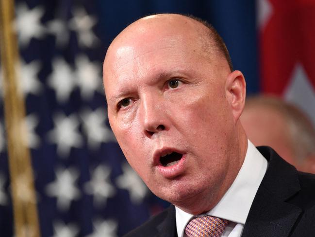 (FILES) A file photo taken on March 5, 2020 shows Australia's then-Home Affairs Minister Peter Dutton during a press conference at the Department of Justice in Washington, DC. - Dutton, who became Australia's new defence minister on March 29, 2021, is a hardline ex-cop who has overseen a controversial refugee policy, riled close ally New Zealand by deporting criminal Kiwis and publicly clashed with the Chinese government. (Photo by Mandel NGAN / AFP)