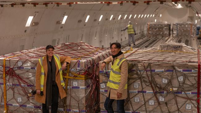 Kristy Carr, chief executive of Bubs Australia, and executive chairman Dennis Lin with boxes of Bubs baby formula being loaded into a cargo plane at Melbourne Airport in June. (Photo by Asanka Ratnayake/Getty Images)