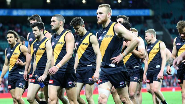 Richmond players walk off the SCG after losing to the Swans by 133 points in 2016. Picture: AAP