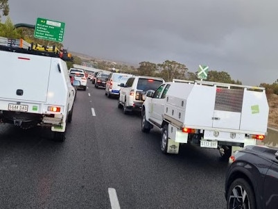 Heavily congested traffic on the Southern Expressway as wild weather lashes the state.