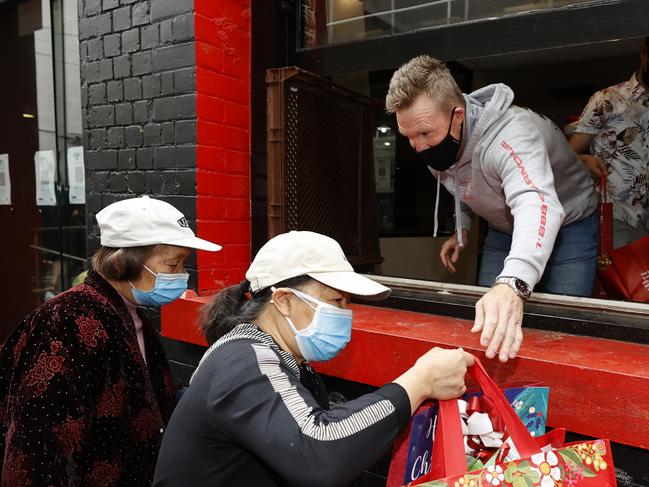 Former coach Nathan Buckley lending a hand. Picture: Alex Coppel