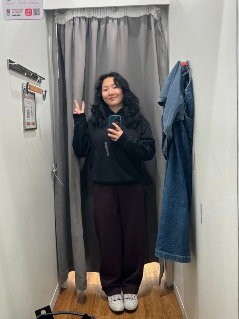 The UNIQLO C Sweat Wide Pants in wine, paired with the navy hoodie in XS. Picture: Supplied/ Cindy Du, news.com.au