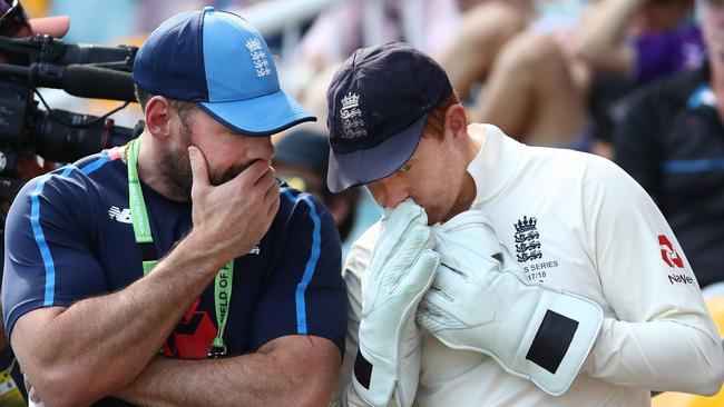 Engalnd wicketkeeper Jonny Bairstow talks to team security chief Sam Dickason yesterday. Picture: Getty Images