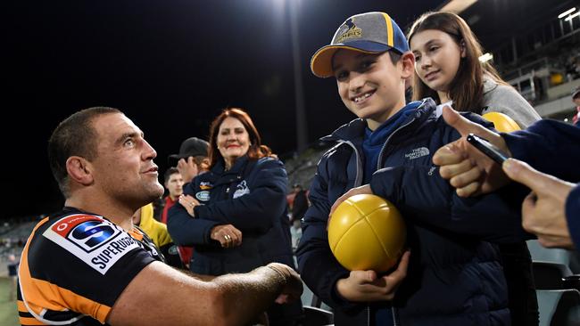 Josh Mann-Rea of the Brumbies with fans after a win at GIO Stadium.