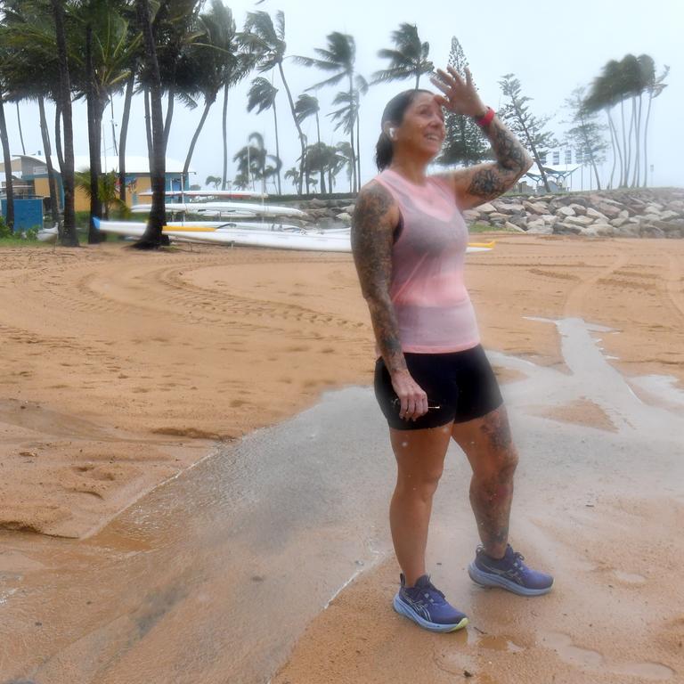 Wet weather in Townsville. Debbie McKay still does her walk along the Strand. Picture: Evan Morgan