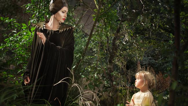 On set ... Angelina Jolie as Maleficent, left, in a scene with her daughter Vivienne Jolie-Pitt, portraying Young Aurora.