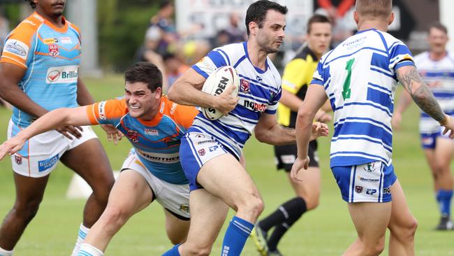 <s1>OPENER: Northern Pride Reef Kings’ Evan Child lunges to make a tackle on Brothers’ Luke Fleming in the opening round of the Lightning Challenge, held at Stan Williams Park on Saturday, which ended in victory to the Northern Pride side. </s1> <ld pattern=" "/> <source>Picture: Stewart McLean</source>