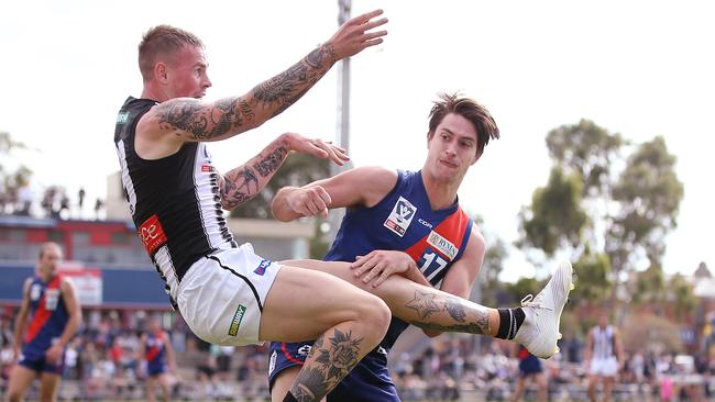 Lochie Dickson puts a bump on Ben Crocker.