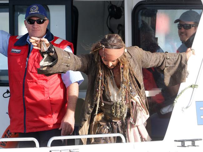 Johnny Depp leaves on a boat to be ferried out to Moreton Bay to continue filming Pirates of the Caribbean. Picture: Liam Kidston