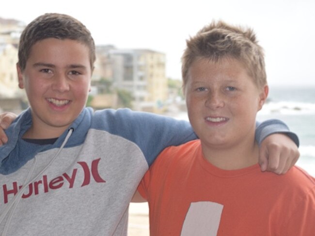 13-year-old Ned Wieland (right), swam solo in the South Head Roughwater on Sunday for Xavier Slezak. Picture: Supplied,