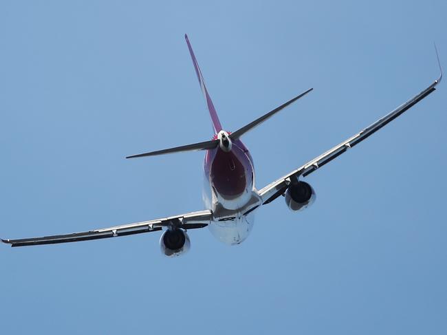 An almost empty Qantas plane departs Cairns Airport. Picture: Brendan Radke