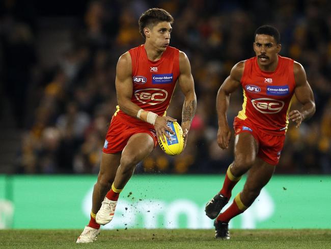 Sean Lemmens of the Suns runs with the ball during the Round 22 AFL match between the Hawthorn Hawks and the Gold Coast Suns at Marvel Stadium in Melbourne, Sunday, August 18, 2019. (AAP Image/Daniel Pockett)