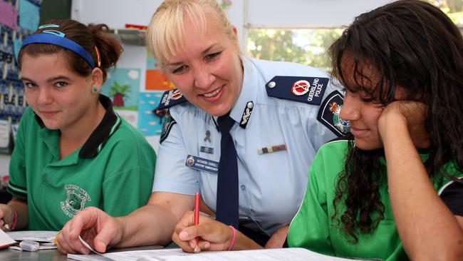 Taeley Smith, 12 (left), with then Far Northern Assistant Police Commissioner Katarina Carroll and Sade Waugh 12 at Cairns West State School.