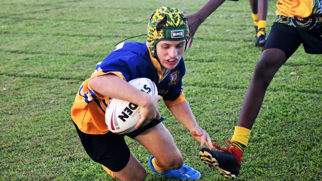 Outstanding player and future league prospect Kelin Corradi, Gilroy, scoring yet another try. Photographs from the Will Murdoch Perpetual Shield. The annual U14 rugby league competition, in its second year, involved Gilroy Santa Maria College, Ingham State High School and St Teresa's Catholic College Abergowrie. Picture: Cameron Bates