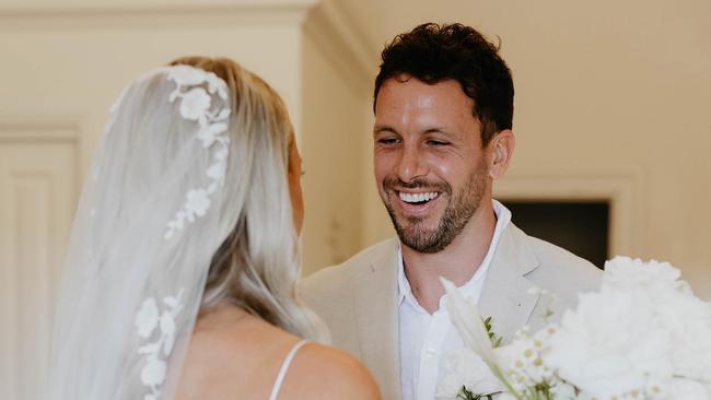 Travis Boak walked his sister Cassie Boak down the aisle on her wedding day. Picture: Captured by Georgie