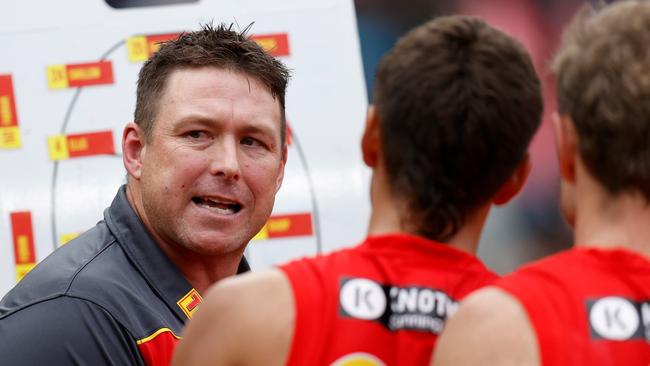 MELBOURNE, AUSTRALIA – MAY 01: Stuart Dew, Senior Coach of the Suns addresses his players during the 2022 AFL Round 07 match between the Collingwood Magpies and the Gold Coast Suns at the Melbourne Cricket Ground on May 01, 2022 in Melbourne, Australia. (Photo by Michael Willson/AFL Photos via Getty Images)