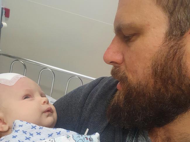 Dad Anton Csik with Henry after the first surgery. Picture: Contributed