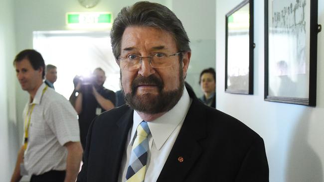 Derryn Hinch held talks with Government MPs late into the night and was confident a 13 per cent backpacker tax deal had been struck. AAP Image/Mick Tsikas