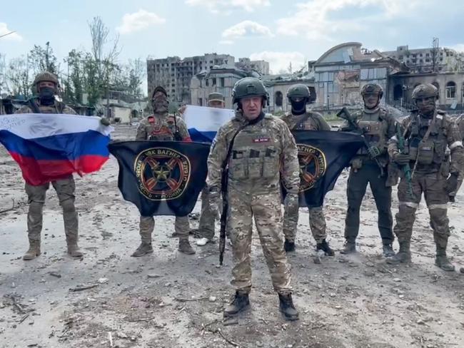 This video grab shows Yevgeny Prigozhin holding a Russian national flag in front of his soldiers in Bakhmut, amid the Russian invasion of Ukraine. Picture: AFP