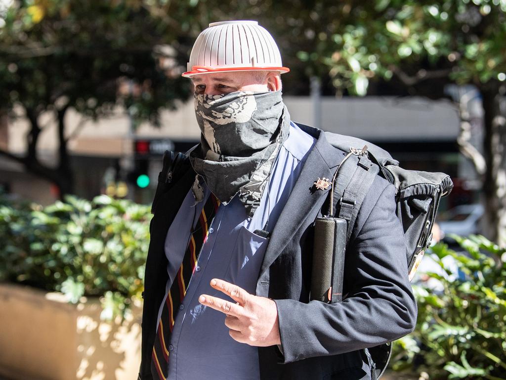 Keith Wass arrives at the Downing Centre wearing a pasta colander on his head. Picture: NCA NewsWire / James Gourley