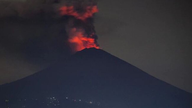 A red glow can be seen on Mt Agung