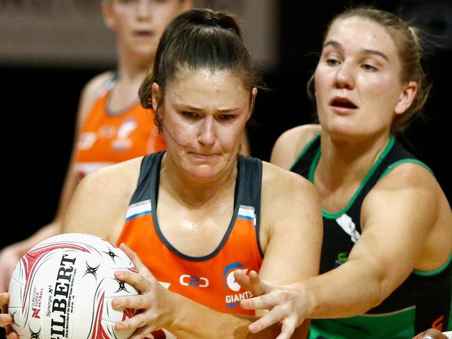 Susan Pettitt of the Giants (left) gains possession from Courtney Bruce of the Fever during the Round 14 Super Netball match between the Giants Netball and the West Coast Fever at the International Convention Centre (ICC) Sydney Theatre in Sydney, Saturday, August 4, 2018. (AAP Image/Jeremy Ng) NO ARCHIVING, EDITORIAL USE ONLY