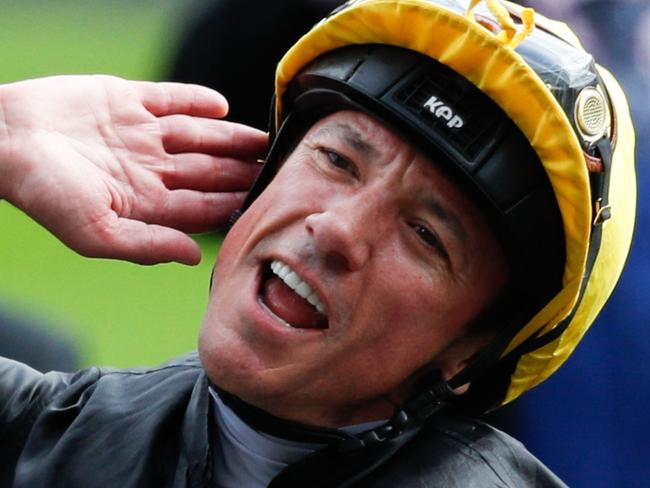 Italian jockey Frankie Dettori celebrates on horse Stradivarius after winning the Gold Cup, his fourth win of the day, on day three of the Royal Ascot horse racing meet, in Ascot, west of London, on June 20, 2019. - The five-day meeting is one of the highlights of the horse racing calendar. Horse racing has been held at the famous Berkshire course since 1711 and tradition is a hallmark of the meeting. Top hats and tails remain compulsory in parts of the course while a daily procession of horse-drawn carriages brings the Queen to the course. (Photo by Adrian DENNIS / AFP)