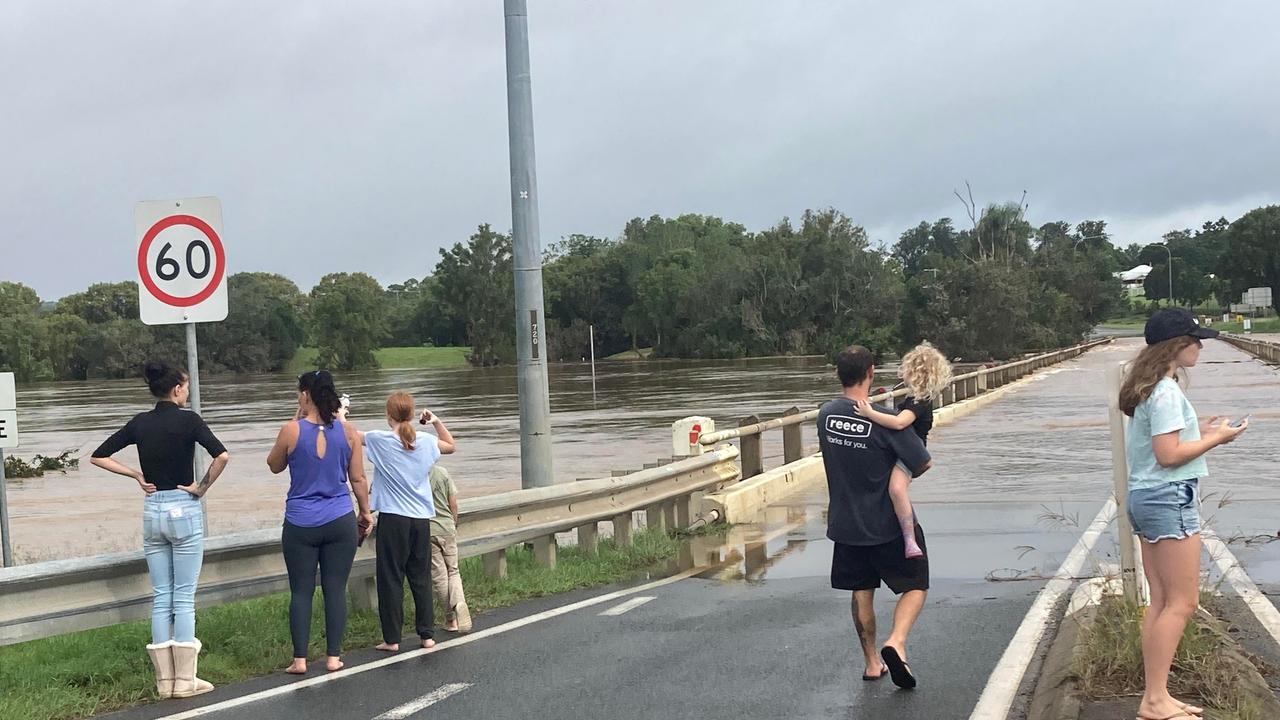 Floodwatchers at the cut off Normanby Bridge at Gympie.