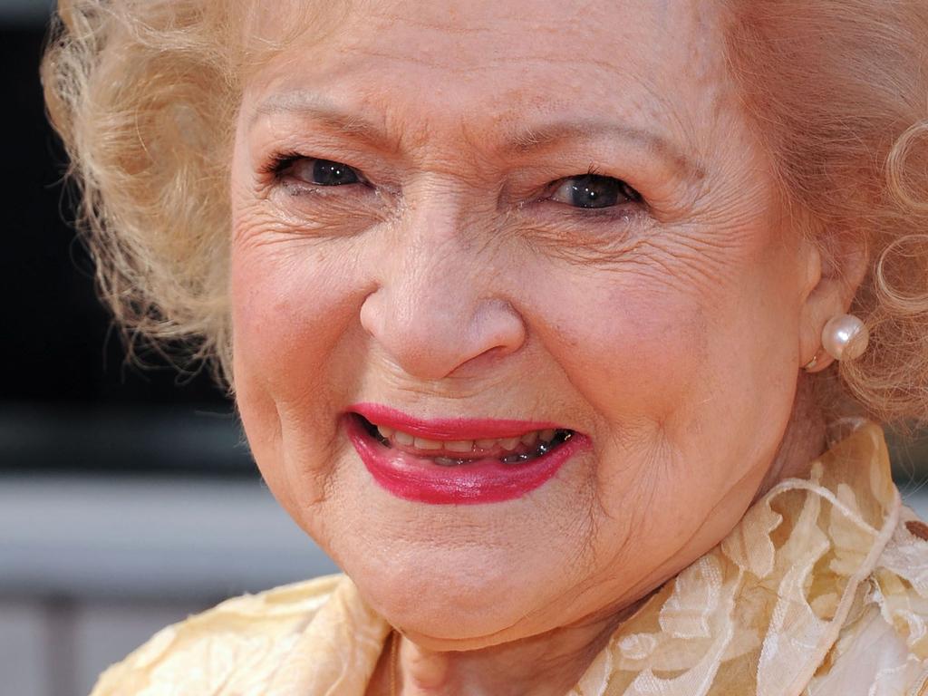 This February 19, 2012 photo shows actress Betty White arrive for the premiere of 'The Lorax' held Universal Citywalk . - White, who made US television audiences laugh for more than seven decades, starring on popular sitcoms "The Golden Girls" and "The Mary Tyler Moore Show," has died at 99 on December 31, 2021. (Photo by Chris DELMAS / AFP)
