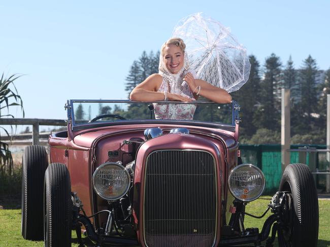 Cooly Rocks On Pin Up finalist Alice Litzow, alias Lady Love Bug, with a custom 1930 Ford Roadster Hot Rod, owned by Sam Clark, one of the cars that will be on display this weekend at Cooly Rocks On. Picture Glenn Hampson