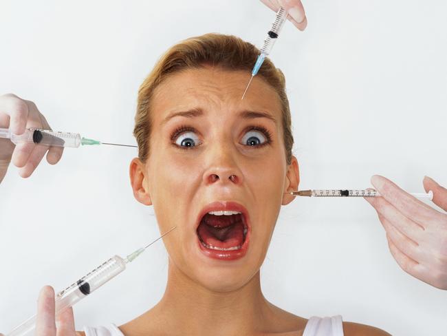 Close-up of a woman screaming while her face is injected. Botox. Generic image. Thinkstock