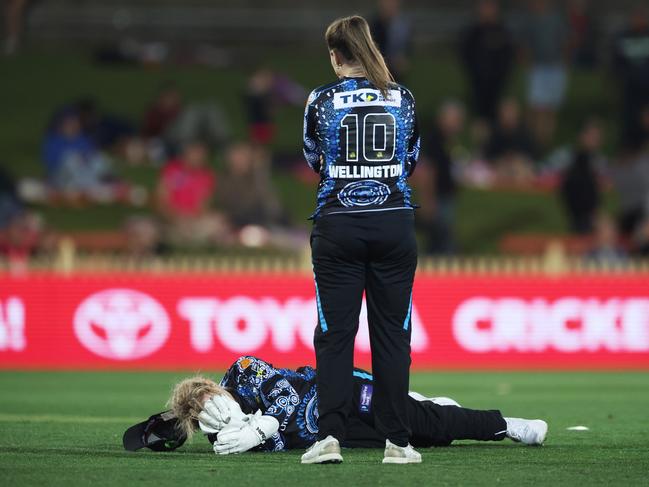 Strikers wicketkeeper Bridget Patterson lays injured after being struck by a ball. Picture: Getty Images