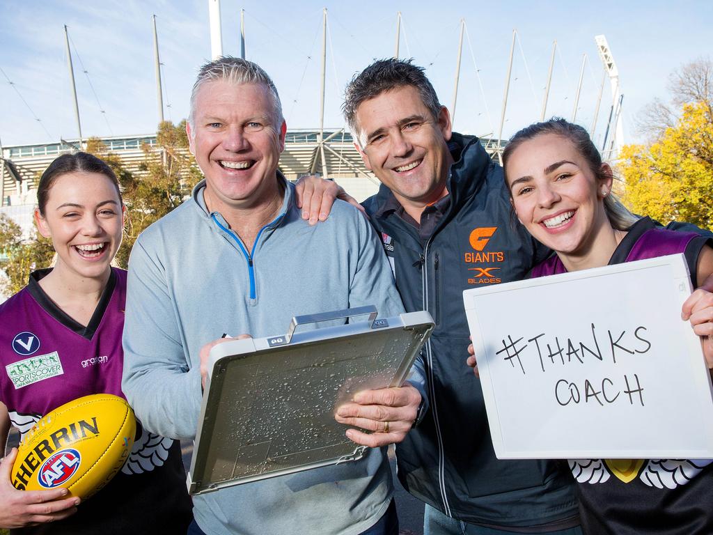 Danny Frawley and Leon Cameron with two of Frawley’s Old Haileybury players Jordan Shanks and Taylah Vines-Chapple. Picture: Mark Stewart