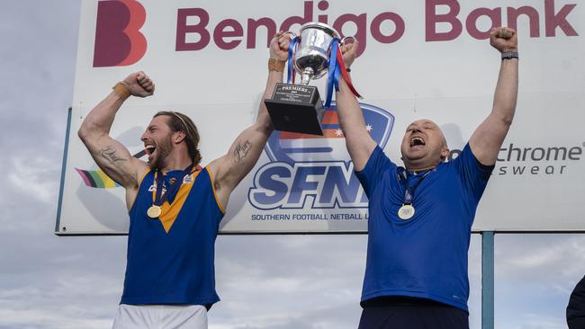 Brandon Osborne (L) lifts the Southern league silverware. Picture: Valeriu Campan