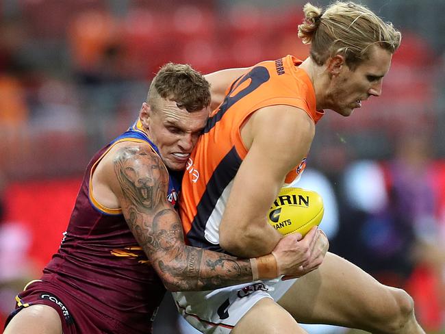 Brisbane's Mitch Robinson tackles Giants Nick Haynes during the AFL match between the GWS Giants and Brisbane Lions at Giants Stadium. Picture. Phil Hillyard
