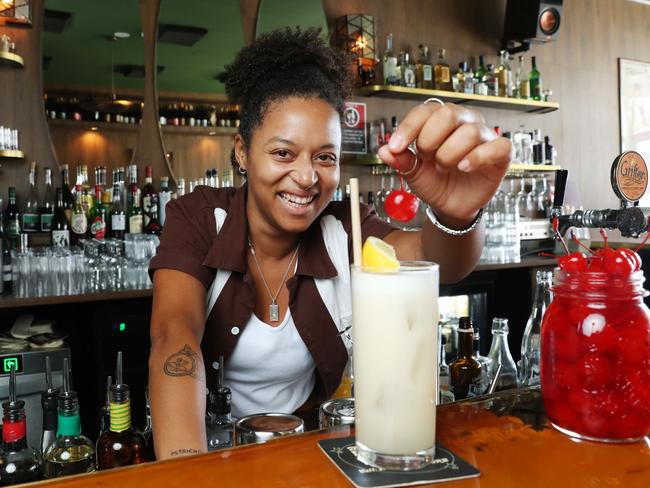 3/2/23: Venue Manager at the Enmore Country Club, Claire Browne makes a cocktail with a Maraschino Cherrie. John Feder/The Australian.