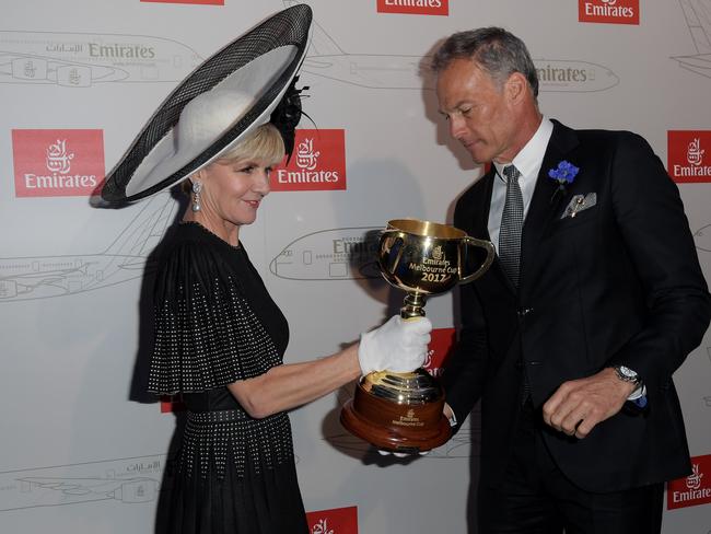 Deputy Liberal leader Julie Bishop and her partner David Panton with the Melbourne Cup in the Emirates Marquee. Picture: Tracey Nearmy, AAP Image.