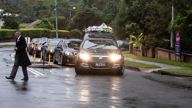 The funeral hearse pauses at the location in Freshwater where Mr Plati was struck by an unknown vehicle. Picture: Julian Andrews