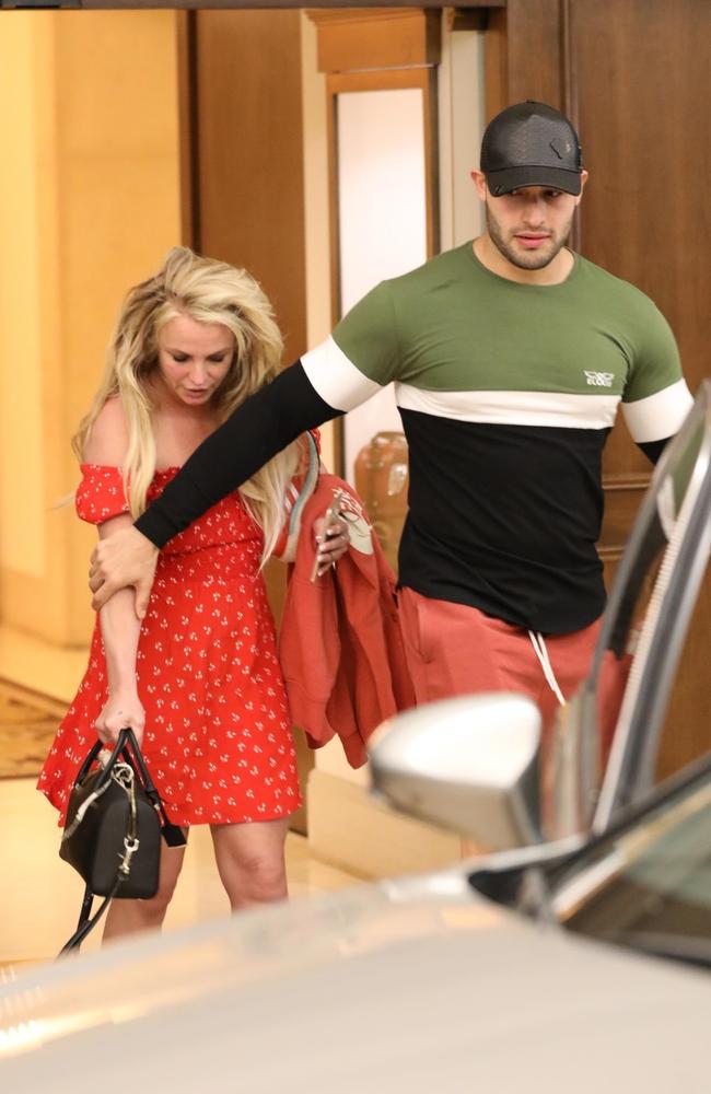 Britney’s boyfriend Sam Asghari appeared to be helping her walk in the shocking photos. Picture: Backgrid