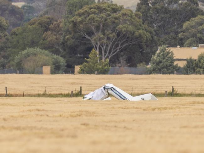 A strewn bit of aircraft lies in a paddock. Picture: Jake Nowakowski