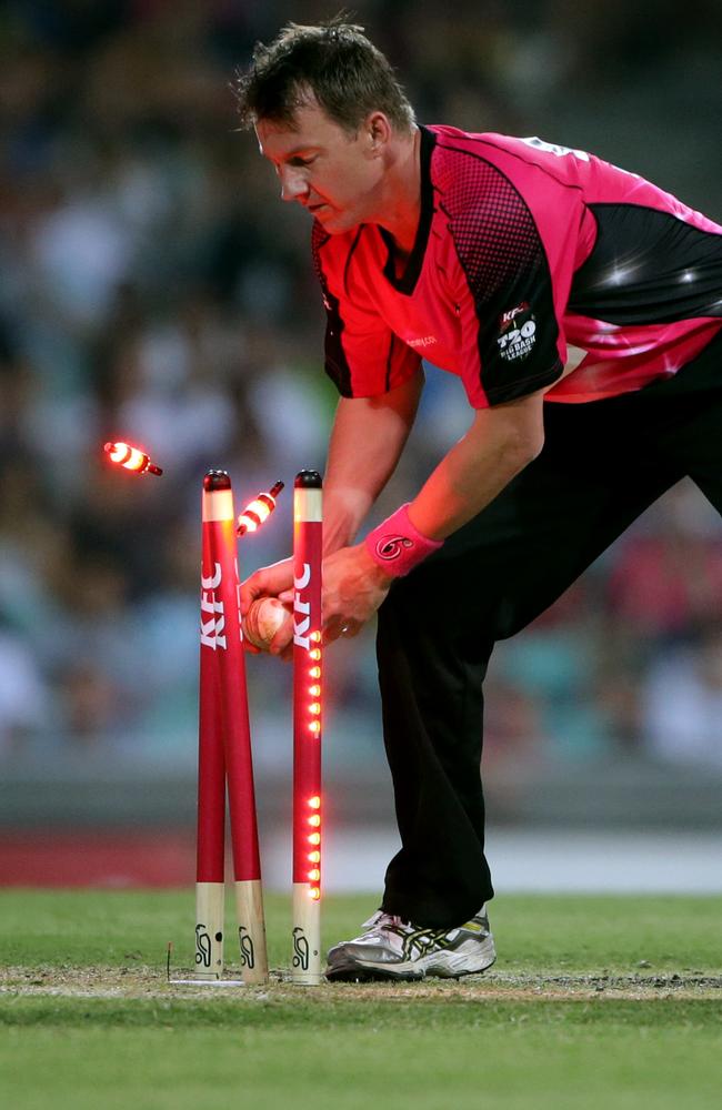 Brett Lee takes the flashing bails off in a Big Bash game in 2012. Picture: Gregg Porteous