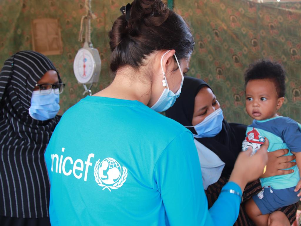 A nine-month-old child with his mother at Hayal Arab health facility, Atbara, River Nile state, to get lifesaving vaccines. Picture: UNICEF