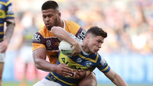 Mitchell Moses of the Eels is tackled by Payne Haas of the Broncos. (Photo by Matt King/Getty Images)