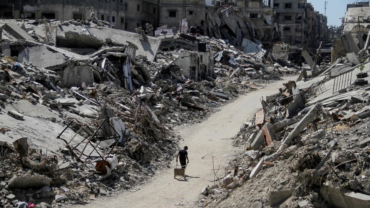 A Palestinian walks among the rubble in Beit Lahia, one of the cities Mr Ya’alon mentioned. Picture: Mahmoud Issa/Reuters