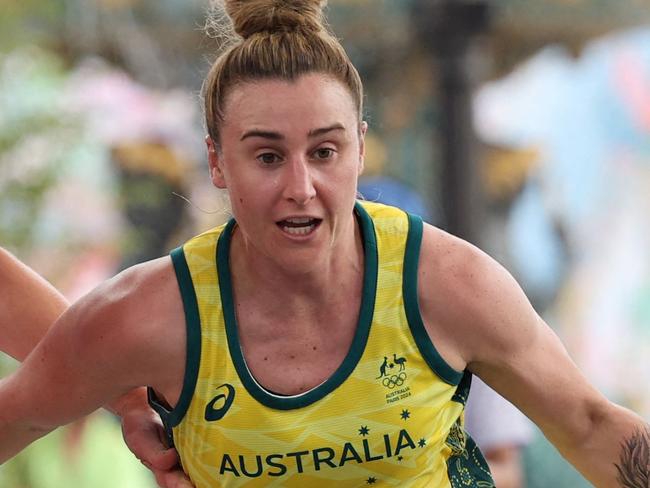 Australia's #33 Lauren Mansfield dribbles past Canada's #02 Katherine Plouffe (L) in the women's pool round 3x3 basketball game between Australia and Canada during the Paris 2024 Olympic Games at La Concorde in Paris on July 30, 2024. (Photo by David GRAY / AFP)