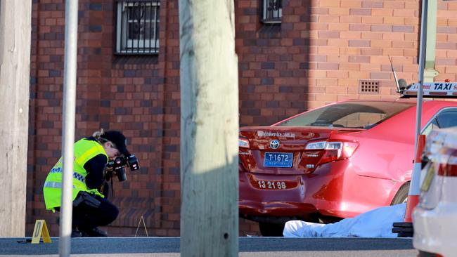 Police take photos following the rampage. Picture: Damian Shaw